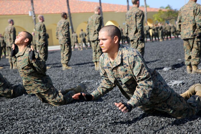 Recruits of Golf Company, 2nd Recruit Training Battalion, perform break falls during the Marine Corps Martial Arts Program test at Marine Corps Recruit Depot San Diego, April 15. If a technique was performed incorrectly during the evaluation, recruits of Company G were given one chance to correct their error. Today, all male recruits recruited from recruiting stations west of the Mississippi are trained at MCRD San Diego. The depot is responsible for training more than 16,000 recruits annually. Company G is scheduled to graduate from recruit training on May 8.