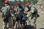 Members of the New York and New Jersey Homeland Response Force (HRF) train to remove victim remains during a Homeland Response Force (HRF) exercise April 18, 2015, at Joint Base McGuire-Dix-Lakehurst. The HRF, with more than 600 personnel, conducted a full-scale exercise for response to a chemical, biological, radiological or nuclear incident here April 15-19. The HRF trains to extract casualties of a CBRN incident and provide decontamination and medical triage in support of civil authorities and first responders.