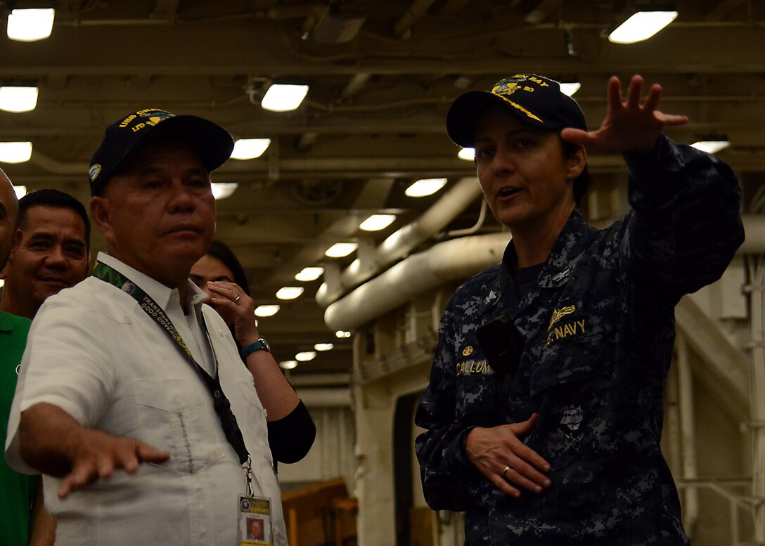 U. S. Navy Capt. Kristy McCallum gives Olongapo City mayor Rolen C. Paulino a tour of forward deployed amphibious transport dock ship USS Green Bay (LPD 20). Green Bay is part of the Bonhomme Richard Amphibious Ready Group and, along with the embarked 31st Marine Expeditionary Unit.