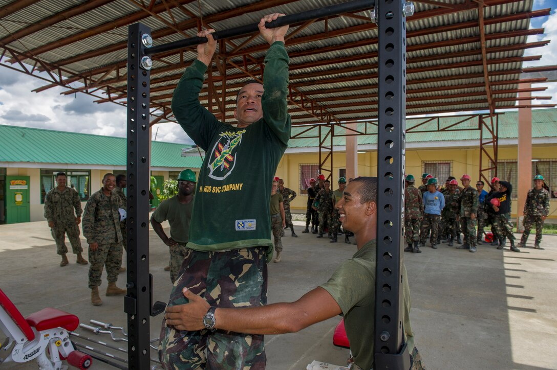 Armed Forces of the Philippines Army Cpl. Jorey Bandejas, assigned to the 552nd Engineer Construction Battalion, participates in a pull-up competition at Don Joaquin Artuz Memorial Elementary School in Tapaz, Philippines, during Balikatan 2015, April 16. Engineers from the Armed Forces of the Philippines Army 552nd Engineer Construction Battalion, along with U.S. Navy Seabees from Naval Mobile Construction Battalion 5 and U.S. Marines from the 9th Engineer Support Battalion, are constructing two classrooms at the school. Balikatan, which means “shoulder to shoulder” in Filipino, is an annual bilateral training exercise aimed at improving the ability of Philippine and U.S. military forces to work together during planning, contingency, humanitarian assistance and disaster relief operations.