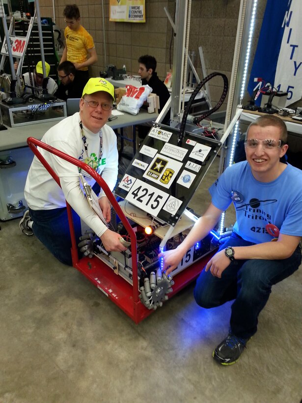 Meet Tom Crump (left). He volunteered March 28, 2015, as a Robot Inspector and Spare Parts coordinator at a FIRST Robotic competition in Duluth, Minnesota. There were about 120 High School robotics teams competing in a game called Recycle Rush. The robots must stack recycling containers and trash cans on top of one another. The teams were given the challenge in early January and had 6 weeks to plan, design, build, program and test their robots. Robots can weigh up to 120 pounds and stand up to 6 feet tall.