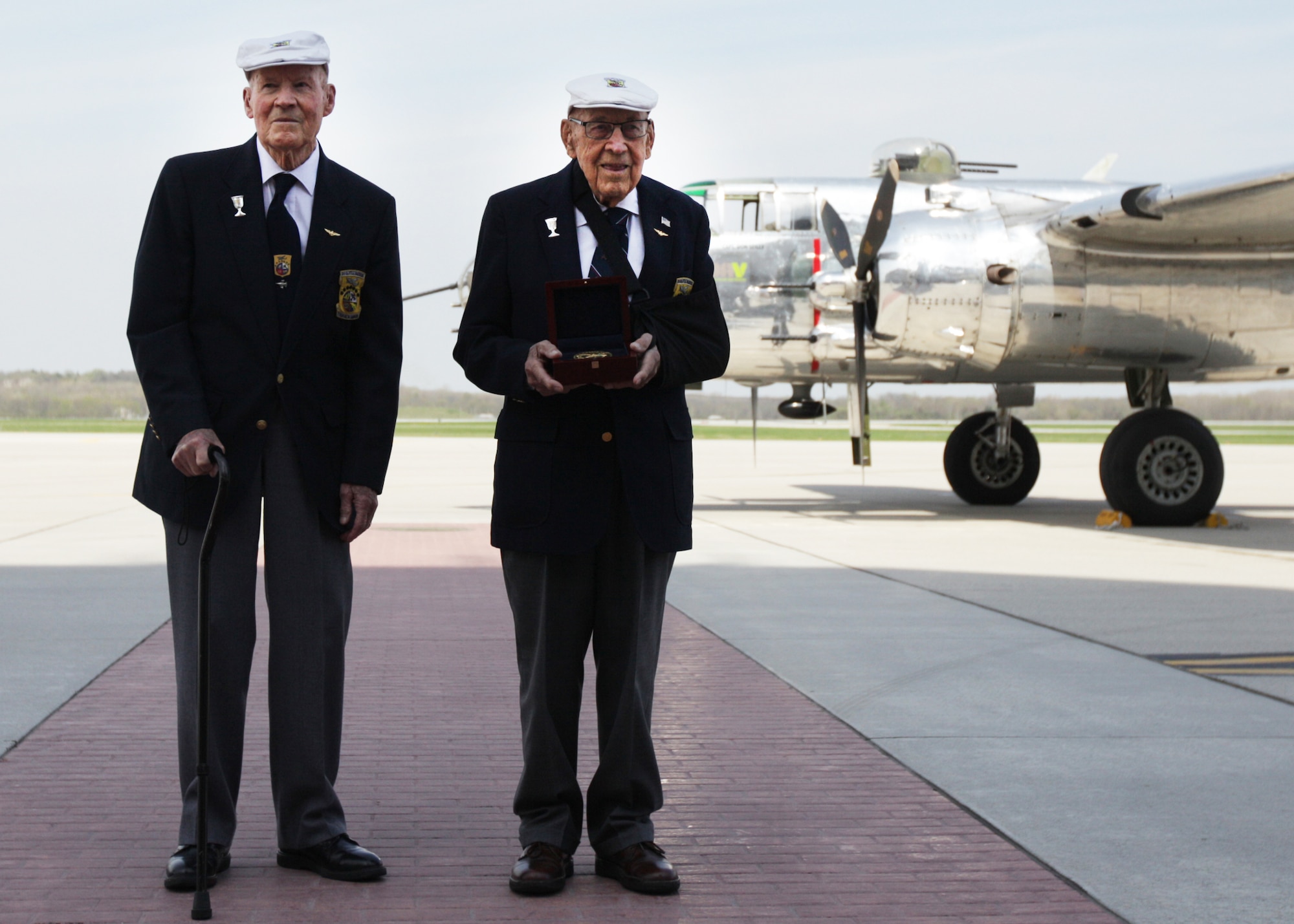 Doolittle Raiders retired Lt. Col. Dick Cole and former Staff Sgt. David Thatcher pose with the Congressional Gold Medal after it arrived at Wright-Patterson Air Force Base, Ohio, following a ceremonial flight on board the B-25 “Panchito” April 18, 2015. The medal is on display in the museum’s World War II Gallery in the Doolittle Raid exhibit. (U.S. Air Force photo/Will Haas)