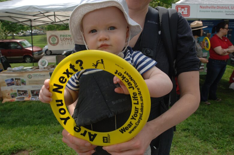 This cutie pie holds a Frisbee with a water safety message she received from the U.S. Army Corps of Engineers Nashville District booth April 18, 2015 during the Nashville Earth Day Festival at Centennial Park.