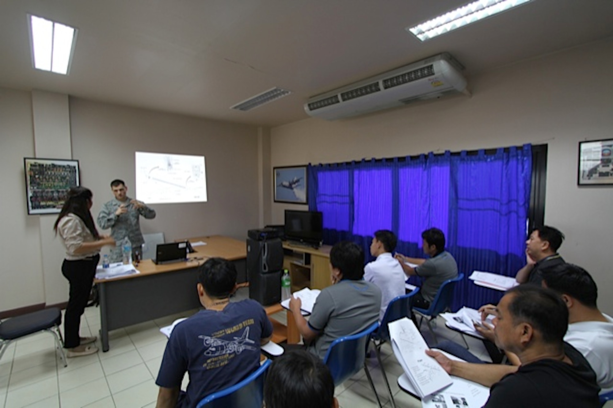 Staff Sgt. Chase Honeycutt utilizes a Royal Thai Air Force classroom to expand on lessons explained on the aircraft.  A team of three U.S. Air Force C-130 aircraft maintainers from Little Rock Air Force Base’s mobile training team embarked on a two-week training partnership with the Royal Thai Air Force in Bangkok, Thailand. (U.S. Air Force photo by Capt. Steve Massara)    