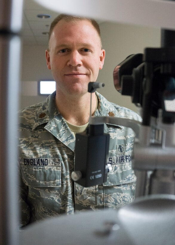 Maj. Craig England, 90th Medical Operations Squadron optometrist, poses for a portrait in his office at the F.E. Warren Medical Treatment Facility, Wyo., April 16, 2015. England is the officer-in-charge of the optometry element. (U.S. Air Force photo by Lan Kim)