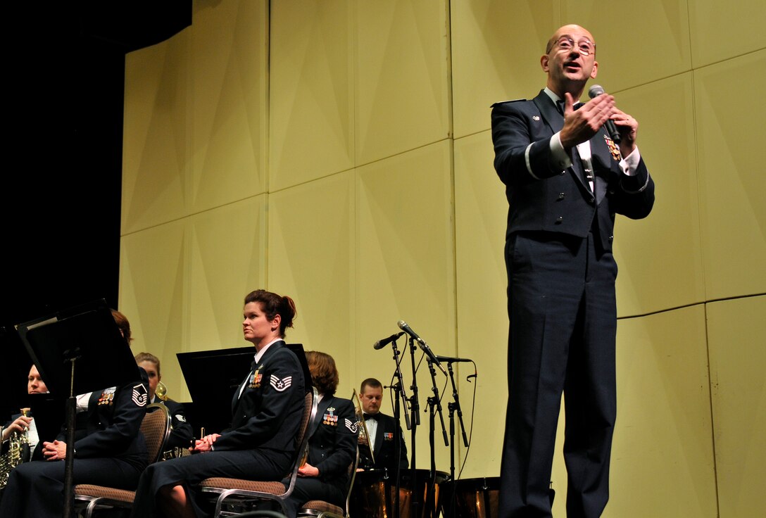 U.S. Air Force Maj. Bryan M. Miller, commander of the 566th Air Force Band, speaks to the audience at the Illinois Music Educators Association conference at the conclusion of the band's opening night performance in Peoria, Ill., Jan. 28, 2015. The 566 AFB serves in war and peace by preserving national heritage through the power of music at military, recruiting and community relations events. (U.S. Air National Guard photo by Staff Sgt. Lealan Buehrer/Released)