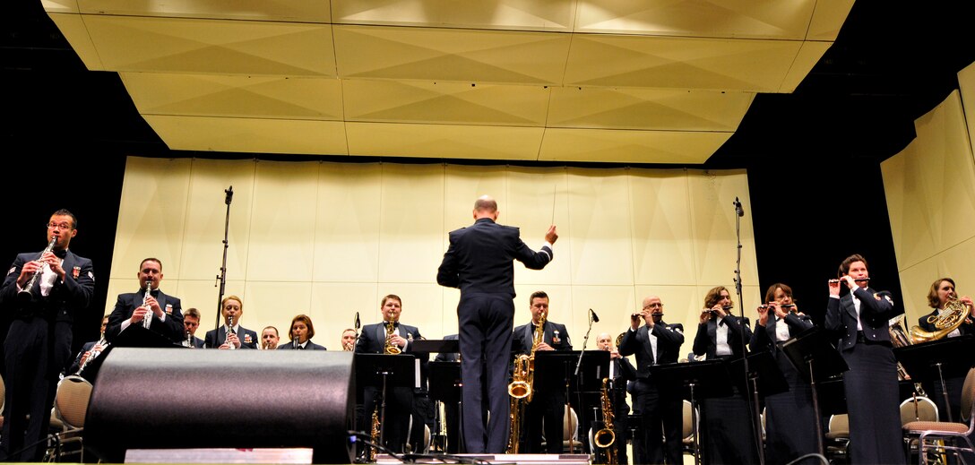 Instrumentalists with the 566th Air Force Band perform at the Illinois Music Educators Association conference opening night in Peoria, Ill., Jan. 28, 2015. The 566 AFB serves in war and peace by preserving national heritage through the power of music at military, recruiting and community relations events. (U.S. Air National Guard photo by Staff Sgt. Lealan Buehrer/Released)