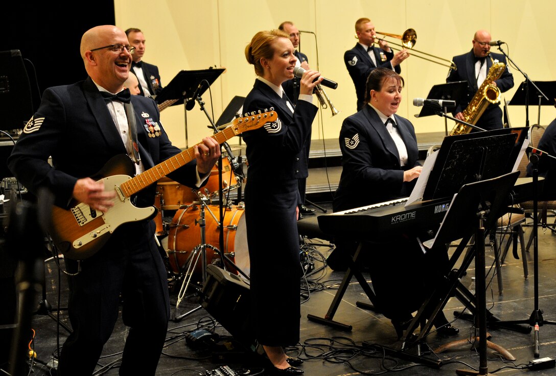 Instrumentalists with the 566th Air Force Band perform "Shake It Off" at the Illinois Music Educators Association conference opening night in Peoria, Ill., Jan. 28, 2015. The 566 AFB serves in war and peace by preserving national heritage through the power of music at military, recruiting and community relations events. (U.S. Air National Guard photo by Staff Sgt. Lealan Buehrer/Released)