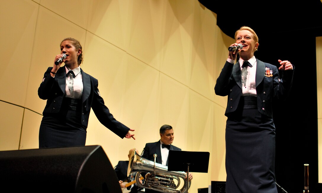 From left, U.S. Air Force Tech. Sgts. Carrie L. Gatz and Amy S. Morys, both instrumentalists with the 566th Air Force Band, perform "All About That Bass" at the Illinois Music Educators Association conference opening night in Peoria, Ill., Jan. 28, 2015. The 566 AFB serves in war and peace by preserving national heritage through the power of music at military, recruiting and community relations events. (U.S. Air National Guard photo by Staff Sgt. Lealan Buehrer/Released)