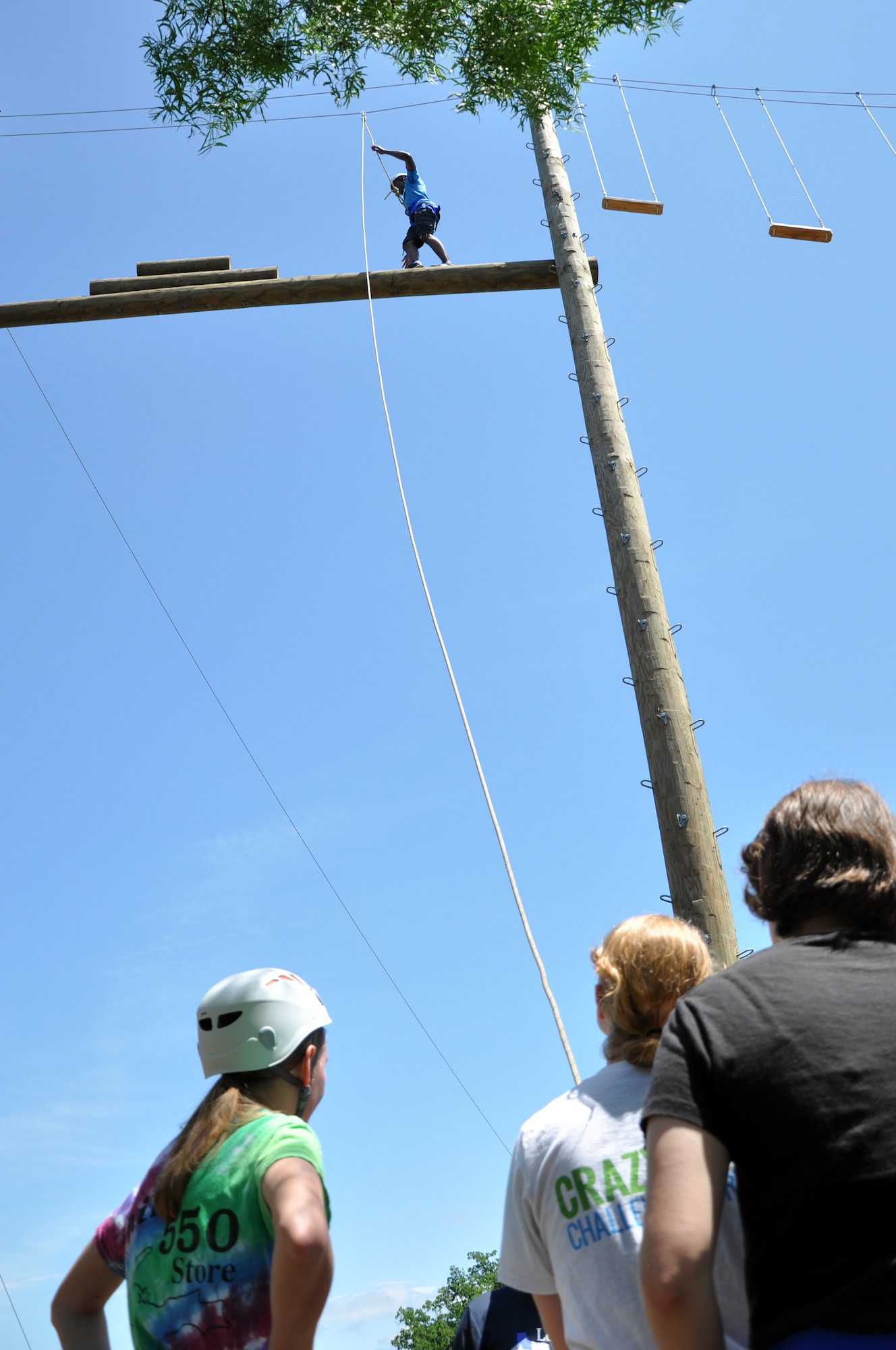 BURNET, Texas – Marine Corps Pfc. Jeremy O. Lynch, Marine Corps Detachment student, walks the catwalk at the Lone Star Peak Performance course April 18. All participants relied on their teammates to safely climb up to and traverse the catwalk, as well as rappel off the obstacle. (U.S. Air Force photo/ Senior Airman Joshua Edwards)