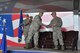 New commander, Col. Craig Shenkenberg, shakes hands with the departing commander, Col. Gregory Gilmour, at the 916th Air Refueling Wing change of command ceremony, April 18, 2015. 