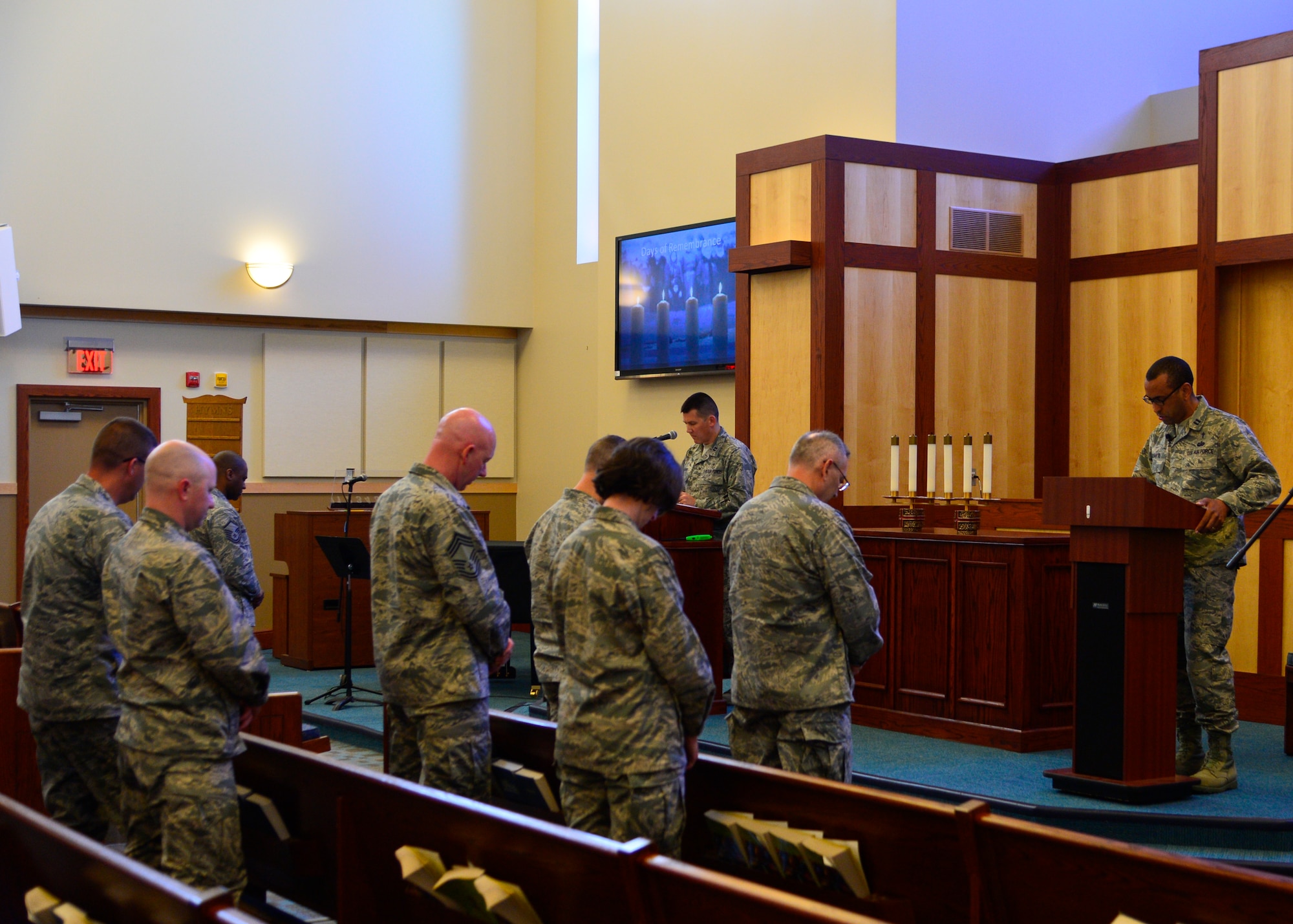 Chaplain (Capt.) Manny Duarte, right, and Chaplain (Capt.) Quentin Genke, left, 436th Airlift Wing chaplains, offer opening prayers during the invocation of the Holocaust Remembrance Observance April 16, 2015, at Chapel 1 on Dover Air Force Base, Del. In 1979, the U.S. Congress established Days of Remembrance as the nation’s annual commemoration of the Holocaust. (U.S. Air Force photo/Airman 1st Class William Johnson)