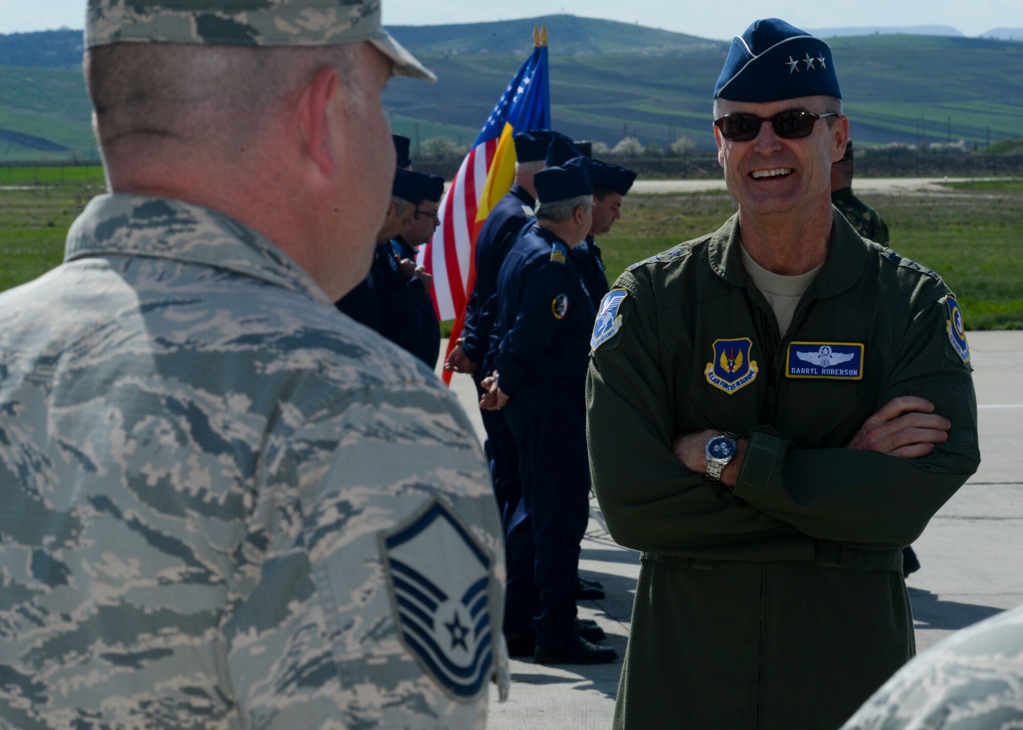 U.S. Air Force Lt. Gen. Darryl Roberson, 3rd Air Force and 17th Expeditionary Air Force commander, right, speaks with Airmen assigned to the 354th Expeditionary Fighter Squadron during the general's visit to Campia Turzii, Romania, April 16, 2015. The general congratulated the Airmen for superior performance in their duties related to Operation Atlantic Resolve while stationed at Campia Turzii. (U.S. Air Force photo by Staff Sgt. Joe W. McFadden/Released)