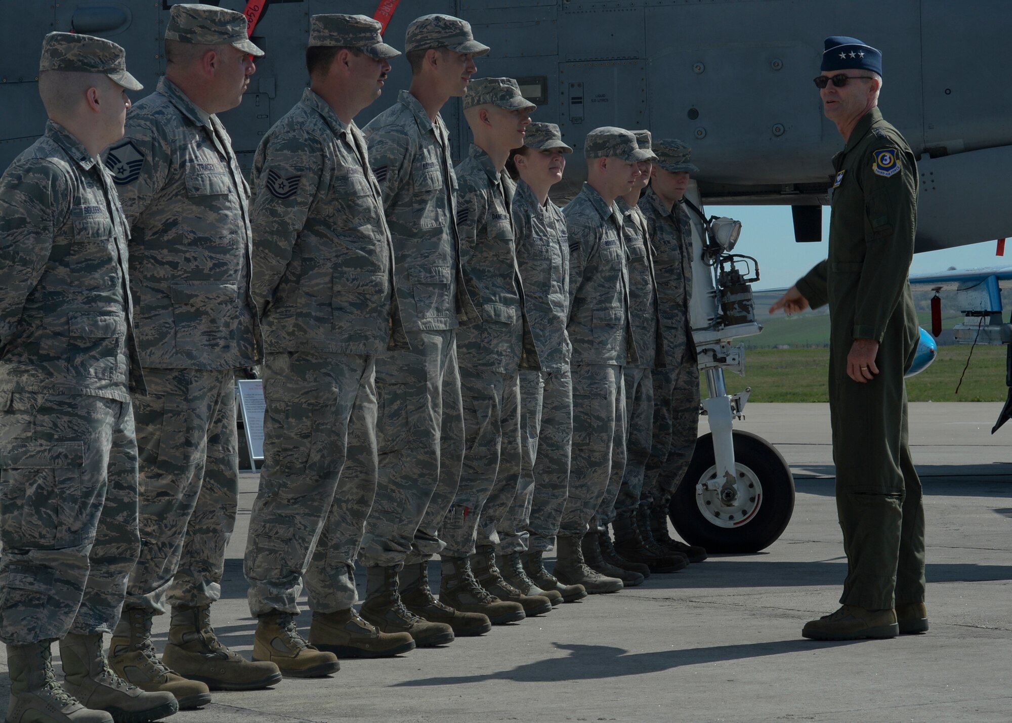 U.S. Air Force Lt. Gen. Darryl Roberson, 3rd Air Force and 17th Expeditionary Air Force commander, right, speaks with Airmen assigned to the 354th Expeditionary Fighter Squadron during the general's visit to Campia Turzii, Romania, April 16, 2015. The general congratulated the Airmen for superior performance in their duties related to Operation Atlantic Resolve while stationed at Campia Turzii. (U.S. Air Force photo by Staff Sgt. Joe W. McFadden/Released)
