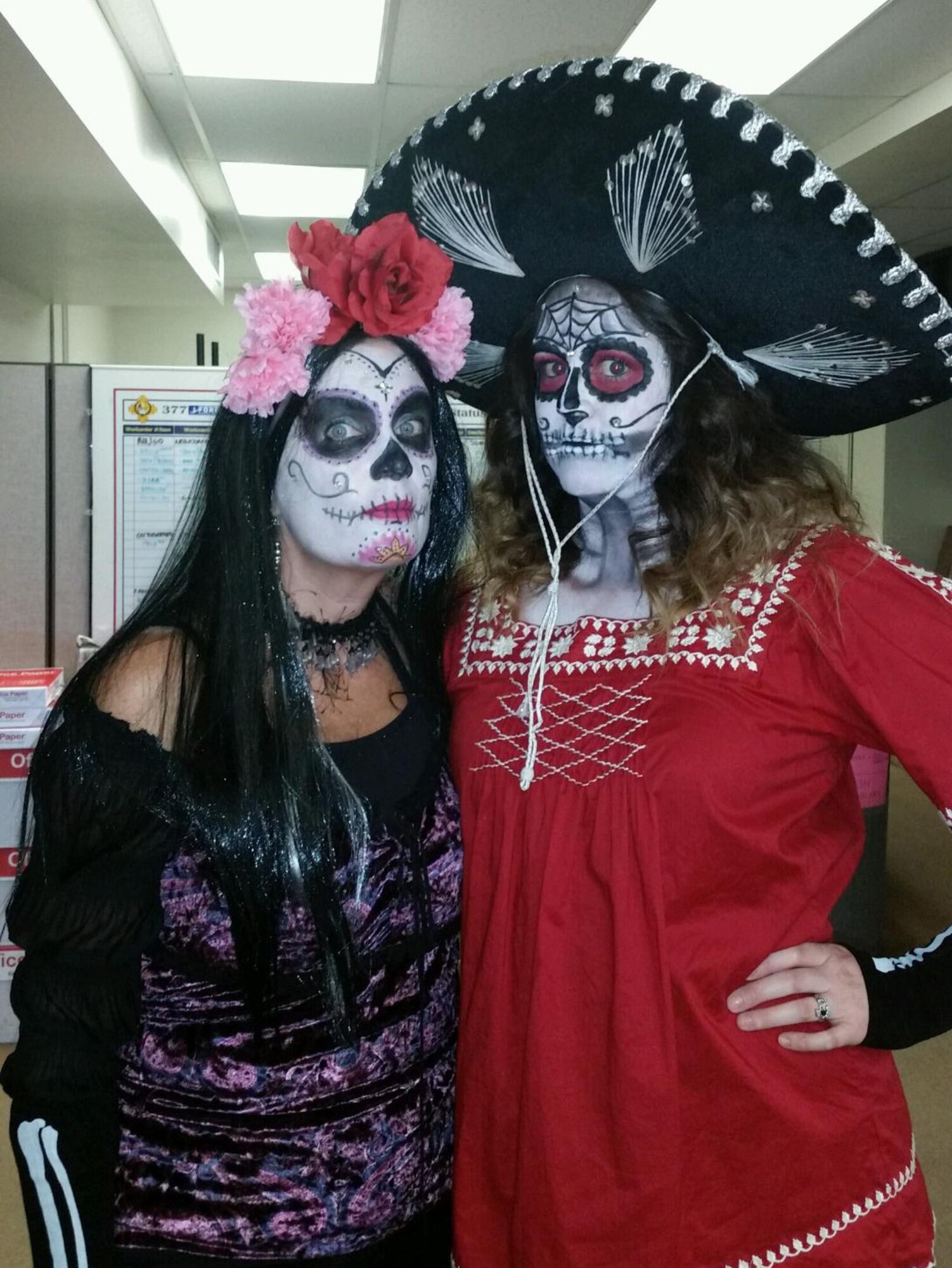 Joanne Perkins, left, and Meaghan Russo dress the part for a 377th Force Support Squadron-sponsored "Day of the Dead" event.  The duo, along with Amanda Chavez, make up the FSS marketing team.  The marketing program won the award for best in the Air Force. (Courtesy photo)