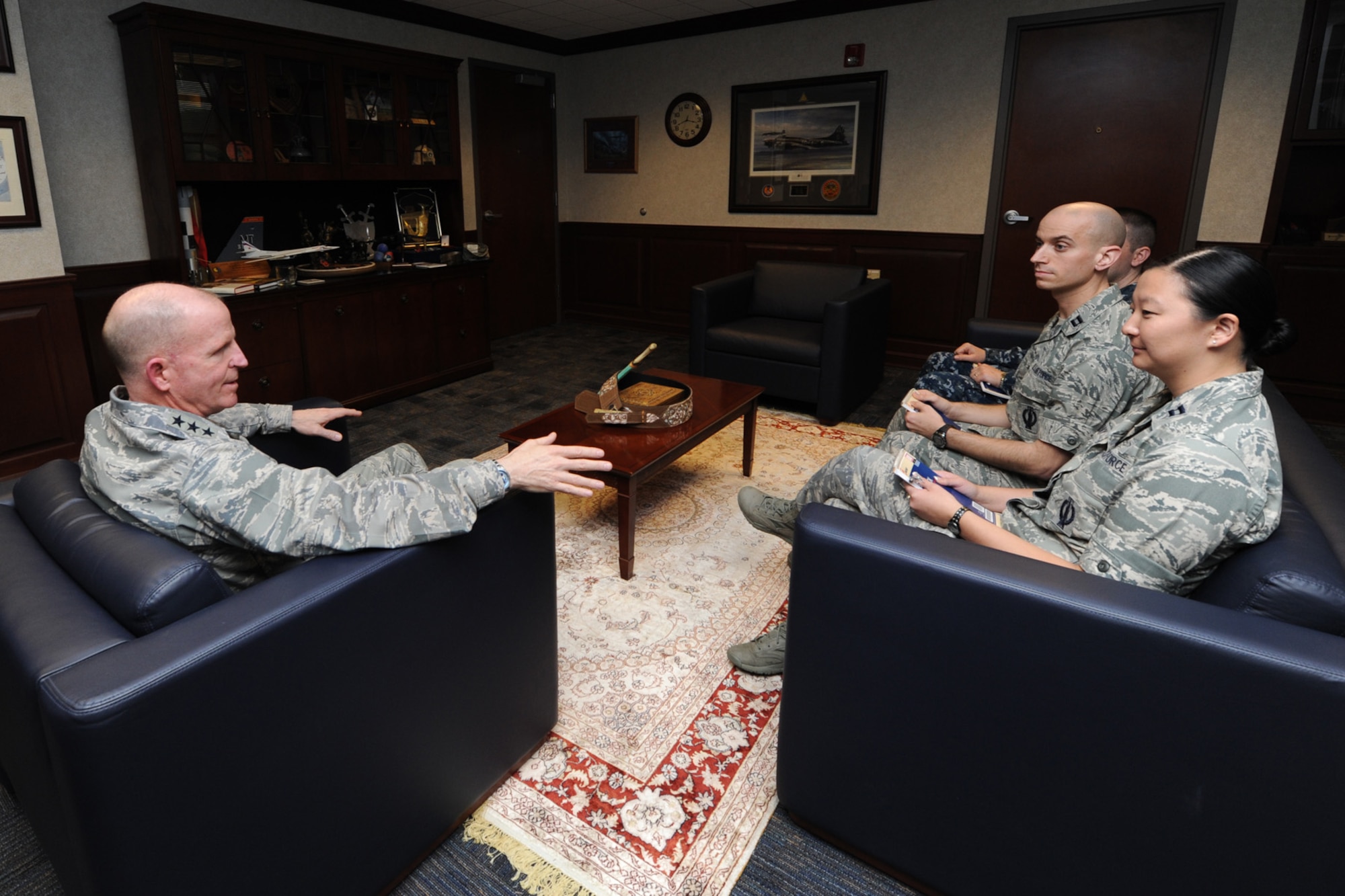 Lt. Gen. Stephen Wilson, the Air Force Global Strike Command commander, speaks with Capt. Jessica Tiffany, 341st Missile Wing, Malmstrom, AFB, Mont., and Capt. Cody daMota, 91st Missile Wing, Minor AFB, N.D., April 15 at Barksdale AFB, La., during a senior leader perspective meeting.  The officers were selected to participate in the highly competitive Striker Trident, a highly competitive Air Force - Navy exchange program that supports professional development of company grade officers trained and qualified in similar nuclear deterrence missions. (U.S. Air Force photo/ Senior Airman Jannelle Dickey)
