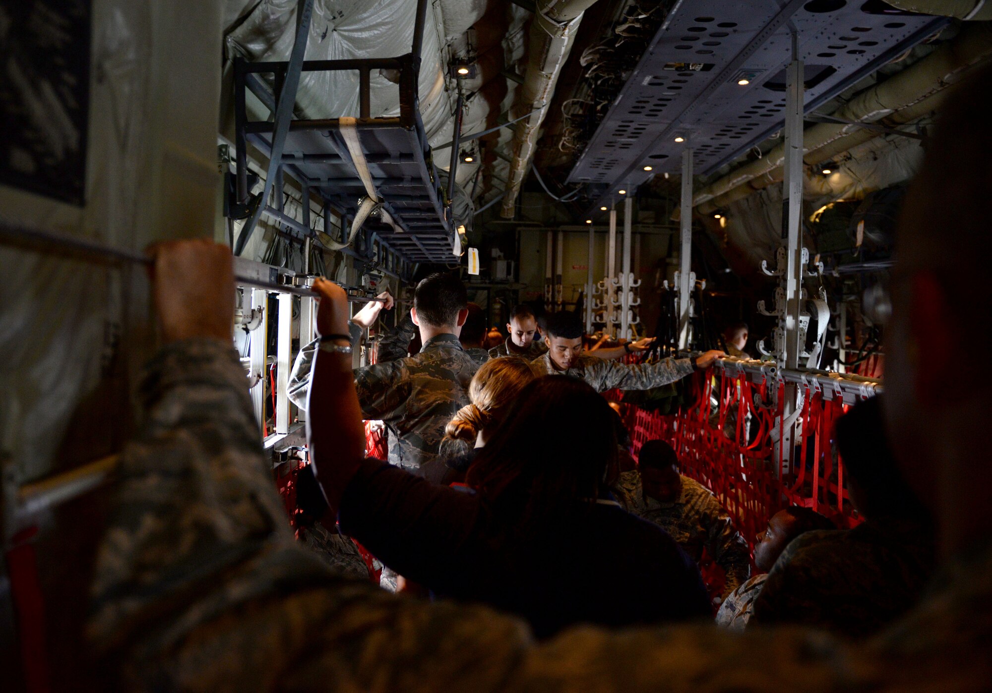 Students of the Southeast and Southwest Region Air Force ROTC Detachments take turns navigating their way to the cockpit of a C130-J Super Hercules during an orientation flight with the 403rdrd Wing during the “Pathways to Blue” diversity outreach event April 18, 2015, Keesler Air Force Base, Miss. Hosted by 2nd Air Force, the event provides a way to demonstrate Keesler’s and Air Education and Training Command’s technical and flight training capabilities while informing cadets about career choices available in the Air Force when deciding what path to take after college. (U.S. Air Force photo by Airman 1st Class Duncan McElroy)