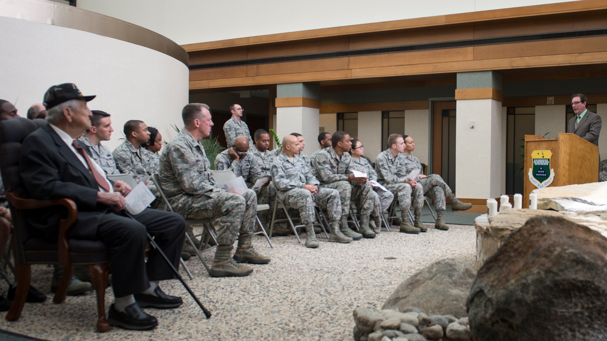 The Rev. Timothy Evans, speaks to Airmen from Air Force Mortuary Affairs Operations, Dover Air Force Base, Del., April 16, 2015, about his father's experience in World War II. Evans' father was assigned to the 84th Armored Medical Battalion and saw firsthand the human toll of the Holocaust. (U.S. Air Force photo/Senior Airman Stacy Buckley)  