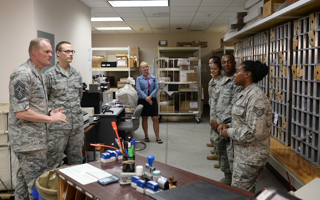 Chief Master Sgt. of the Air Force James A. Cody discusses the future of the postal career field with Staff Sgt. Brittany Smith, a postal clerk April 14, 2015, at Joint Task Force - Bravo, Soto Cano Air Base, Honduras. The post office at Soto Cano Air Base receives mail for approximately 1,200 military members and civilians at Soto Cano. (U.S. Air Force photo by Staff Sgt. Jessica Condit)