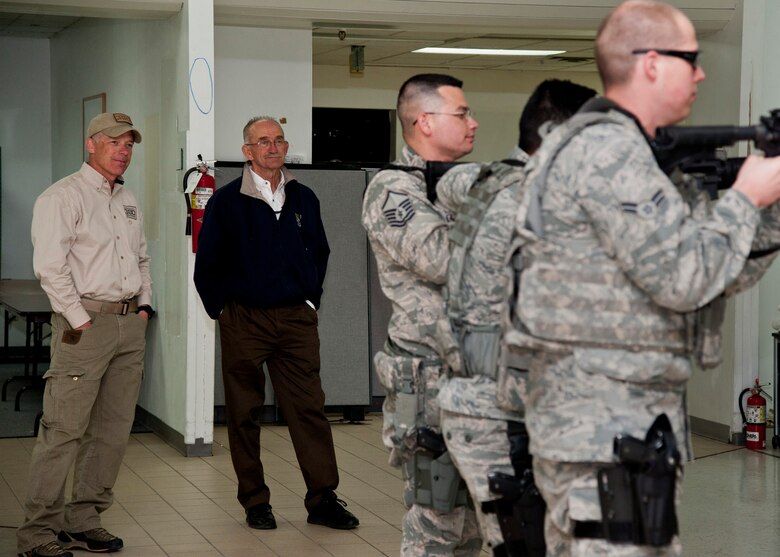 PETERSON AIR FORCE BASE, Colo. – Robi Powers, veteran and founder of the American300 tour, and retired Maj. Gen. Edward Mechenbier listen in on a 21st Security Forces Squadron class during an American300 tour April 14, 2015. The American300 is a volunteer, non-profit organization which focuses on spending quality time with service members, bringing subject matter experts on resiliency to mentor and embed a sense of hope and understanding of the capabilities people possess in certain situations whether it is in war or on the home front. (U.S. Air Force photo by Senior Airman Tiffany DeNault)