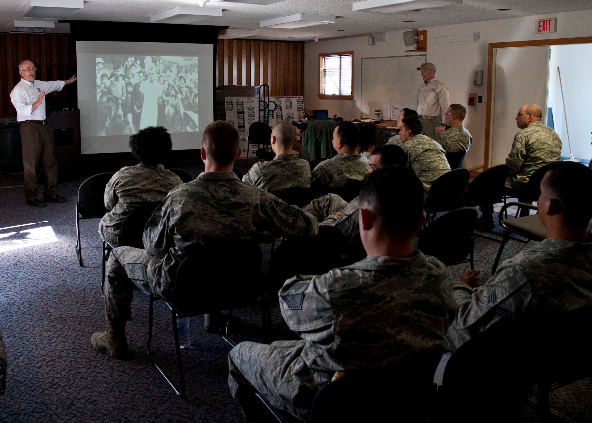 CHEYENNE MOUNTAIN AIR FORCE STATION, Colo. – Retired Maj. Gen. Edward Mechenbier tells his story of being a prisoner of war for six years during the Vietnam War to members of the 721st Security Forces Squadron during an American300 tour April 13, 2015. The American300 is a volunteer, non-profit organization which focuses on spending quality time with service members, bringing subject matter experts on resiliency to mentor and embed a sense of hope and understanding of the capabilities people possess in certain situations whether it is in war or on the home front. (U.S. Air Force photo by Senior Airman Tiffany DeNault)