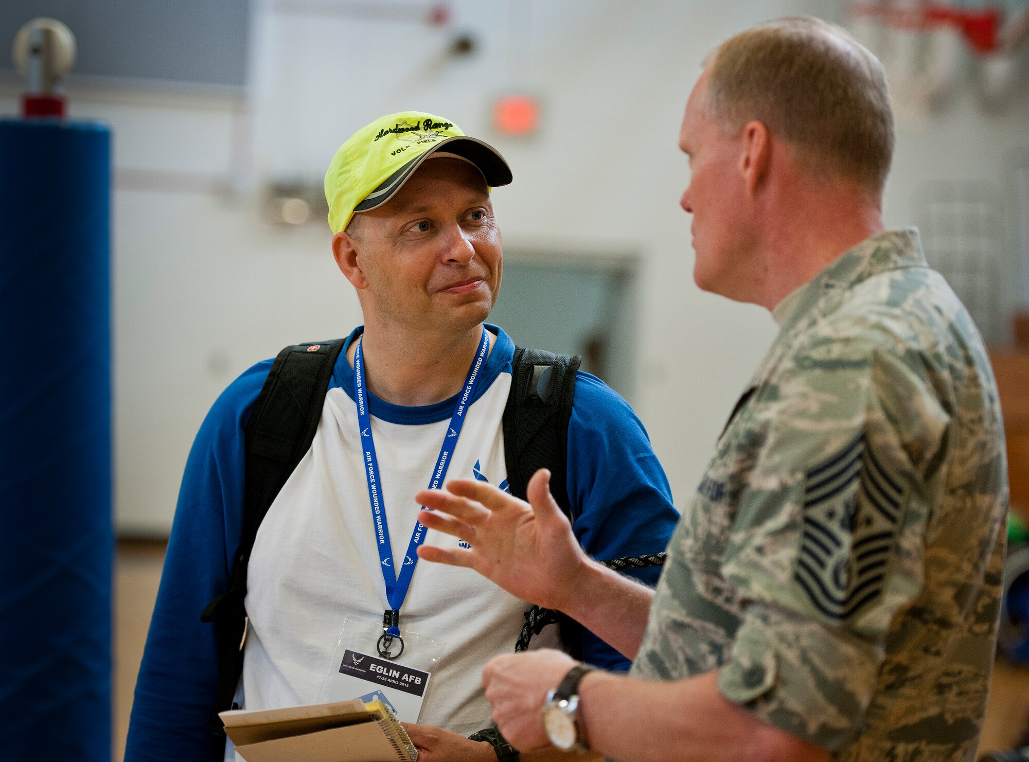 Air Force Wounded Warrior athlete, Richard Gustafson, listens intently to Chief Master Sgt. of the Air Force James Cody during the athletes' training camp at Eglin Air Force Base, Fla., April 19.  During the Chief's visit, he praised the athletes' efforts and encouraged them to give their all at the camp and the upcoming Warrior Games in June.  (U.S. Air Force photo/Samuel King Jr.)