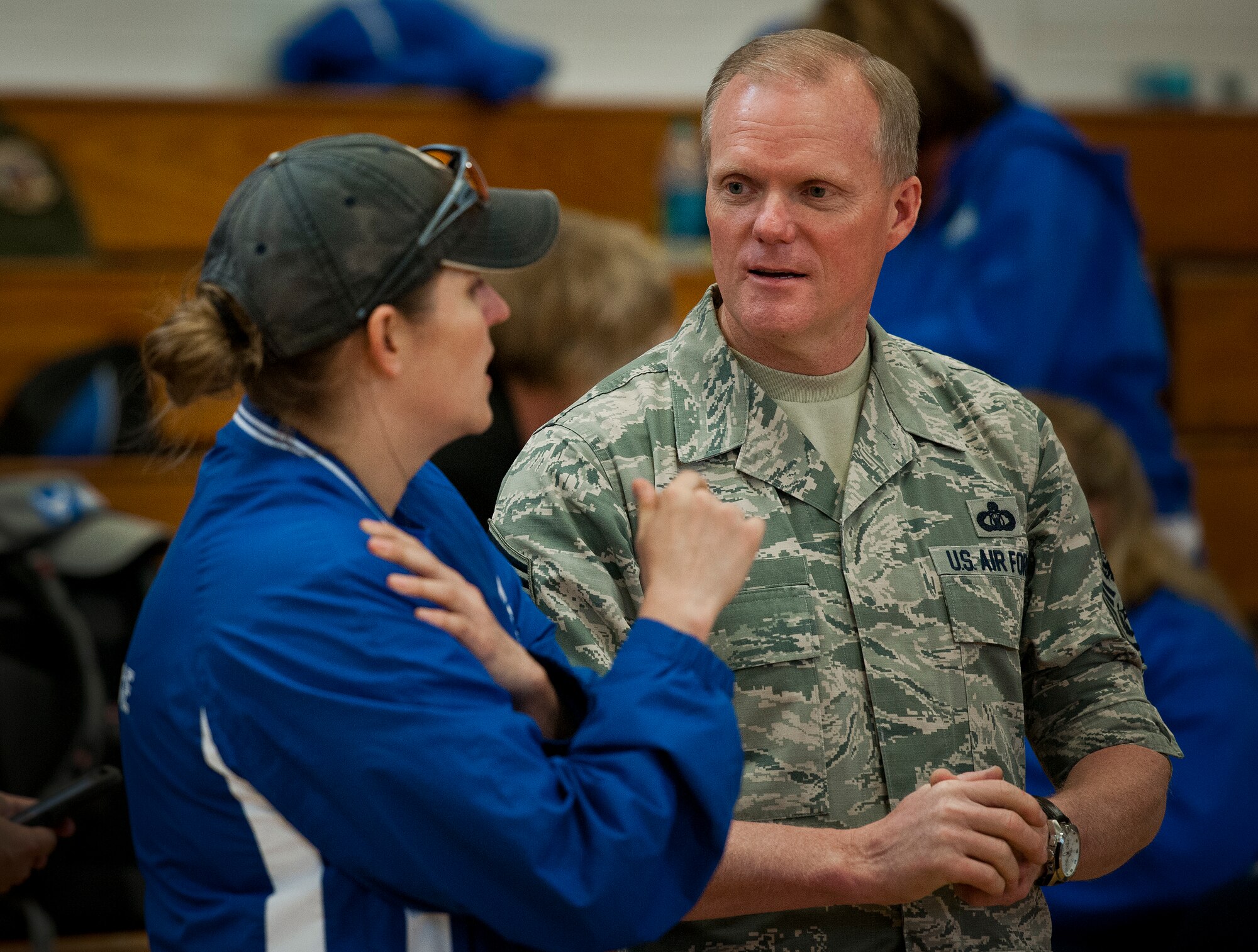 Air Force Wounded Warrior athlete, Kyle Burnett, talks with Chief Master Sgt. of the Air Force James Cody during the athletes' training camp at Eglin Air Force Base, Fla., April 19.  During the Chief's visit, he praised the athletes' efforts and encouraged them to give their all at the camp and the upcoming Warrior Games in June.  (U.S. Air Force photo/Samuel King Jr.)