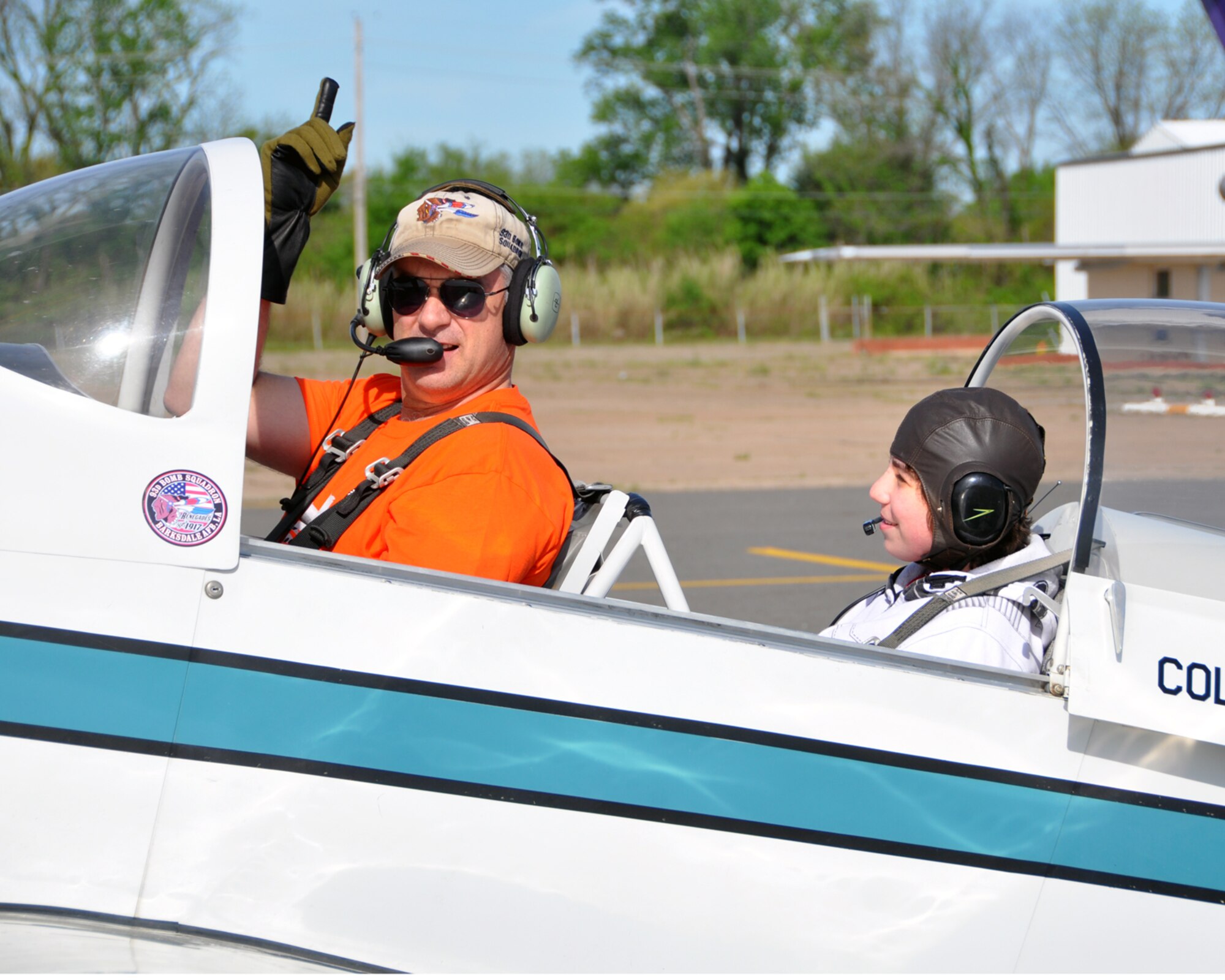 Colonel Dave Leedom, assigned to the 8th Air Force, gives the “All Clear” signaling he is preparing to start the engine of his aircraft at the Shreveport Downtown Airport in Louisiana. Col. Leedom was giving a future aviator an incentive ride during the Young Eagles day on April 11, 2015. The Young Eagles program has flown more than 1.9 million future aviators since their conception in 1992. (U.S. Air Force photo by Master Sgt. Laura Siebert/Released)