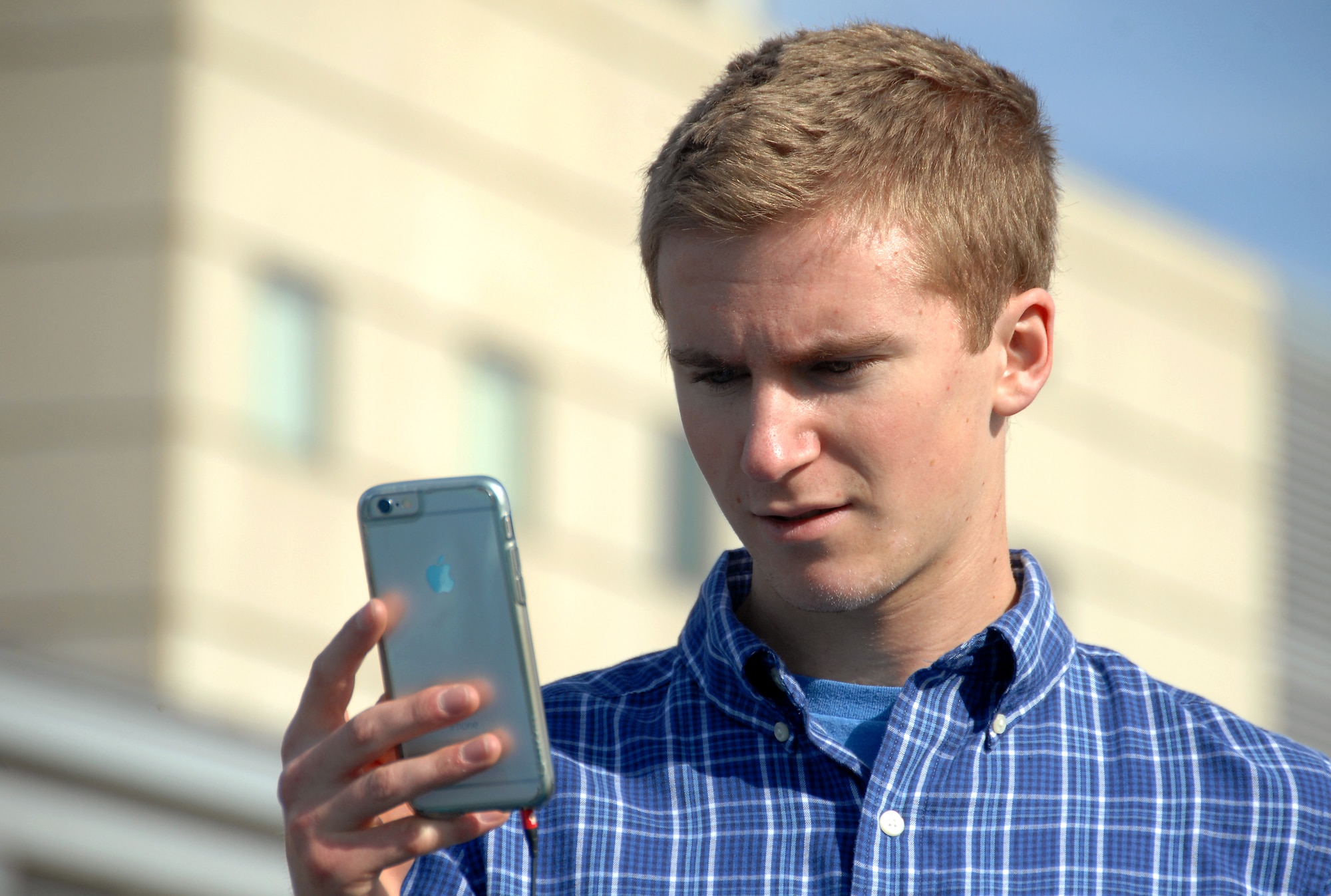 Grant Harrison, a senior at Bellevue West High School, streams live video of a weather balloon and sensor package launch to the mission control center located inside the Peter Kiewit Institute at the University of Nebraska at Omaha campus April 14, 2015. He was participating in Project HALON, or High Altitude Learning over Nebraska, which is a program sponsored by NASA through the University of Nebraska. (U.S. Air Force photo by Delanie Stafford/Released)