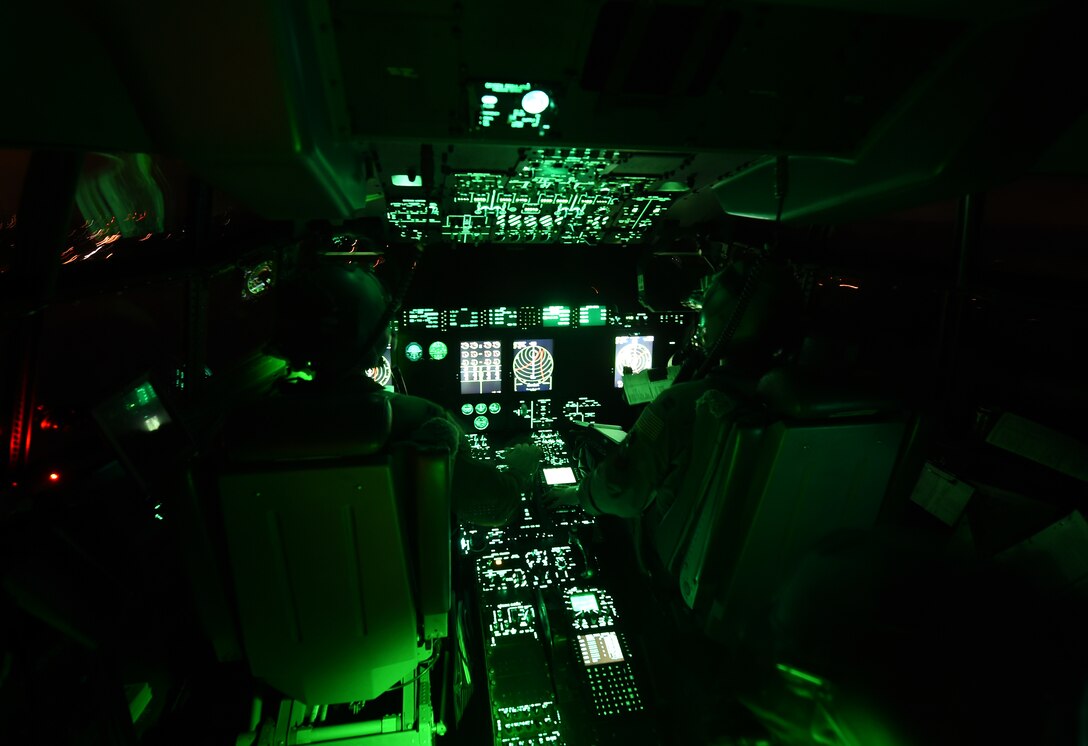 U.S. Air Force pilots from the 317th Airlift Group, stationed at Dyess Air Force Base, Texas, fly a C-130J Super Hercules April 17, 2015, at Polk Army Air Field, Louisiana. The 317th AG delivered U.S. Army Soldiers from the 1st Brigade Combat Team, 82nd Airborne Division, to Polk Army Airfield during a Global Force Readiness Exercise. The exercise exhibited the partnership between the Air Force and Army and their ability to execute personnel airdrop from a large formation. (U.S. Air Force photo by Senior Airman Peter Thompson/Released)