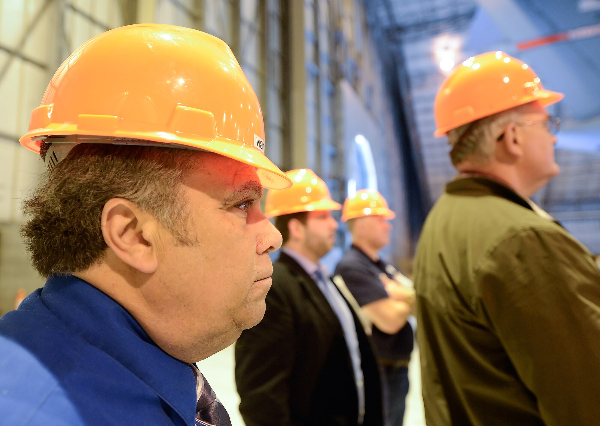 Robin Christiansen, left, 436th Civil Engineer Squadron honorary commander, listens to a briefing on the isochronal maintenance process performed by the 436th Maintenance Group during the 2015 Dover Air Force Base Honorary Commanders tour of a C-5B undergoing the process April 15, 2015, on Dover Air Force Base, Del. Christiansen is the mayor of the city of Dover, Del. (U.S. Air Force photo/Greg L. Davis)