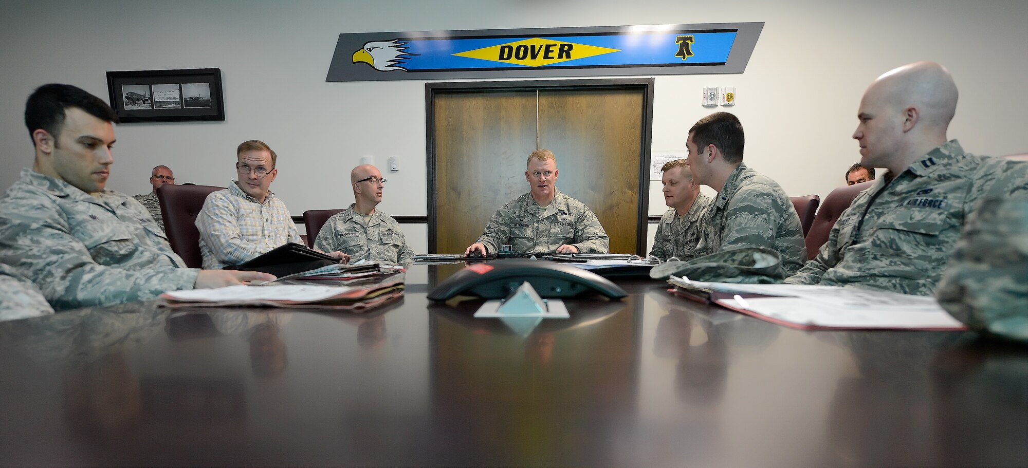Col. Charles Nesemeir, 436th Maintenance Group commander, center, conducts the morning maintenance production meeting with other key players visible at the table April 15, 2015, on Dover Air Force Base, Del. The 2015 Dover AFB Honorary Commanders witnessed the meeting during a tour of the 436th MXG. (U.S. Air Force photo/Greg L. Davis)