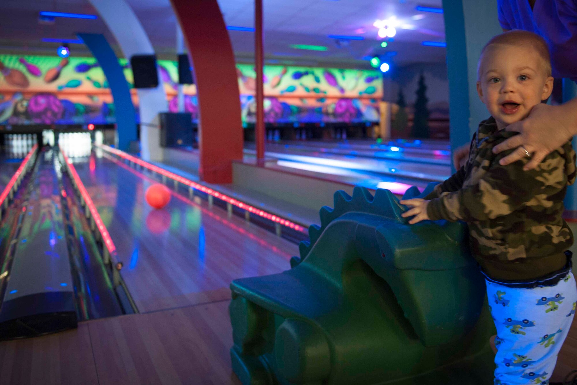 Jack Pruim poses for a photo after rolling a bowling ball on Minot Air Force Base, N.D., April 15, 2015. In honor of the month of the military child, face painting and free bowling were offered at Rough Rider Lanes. (U.S. Air Force photo/Airman 1st Class Sahara L. Fales)