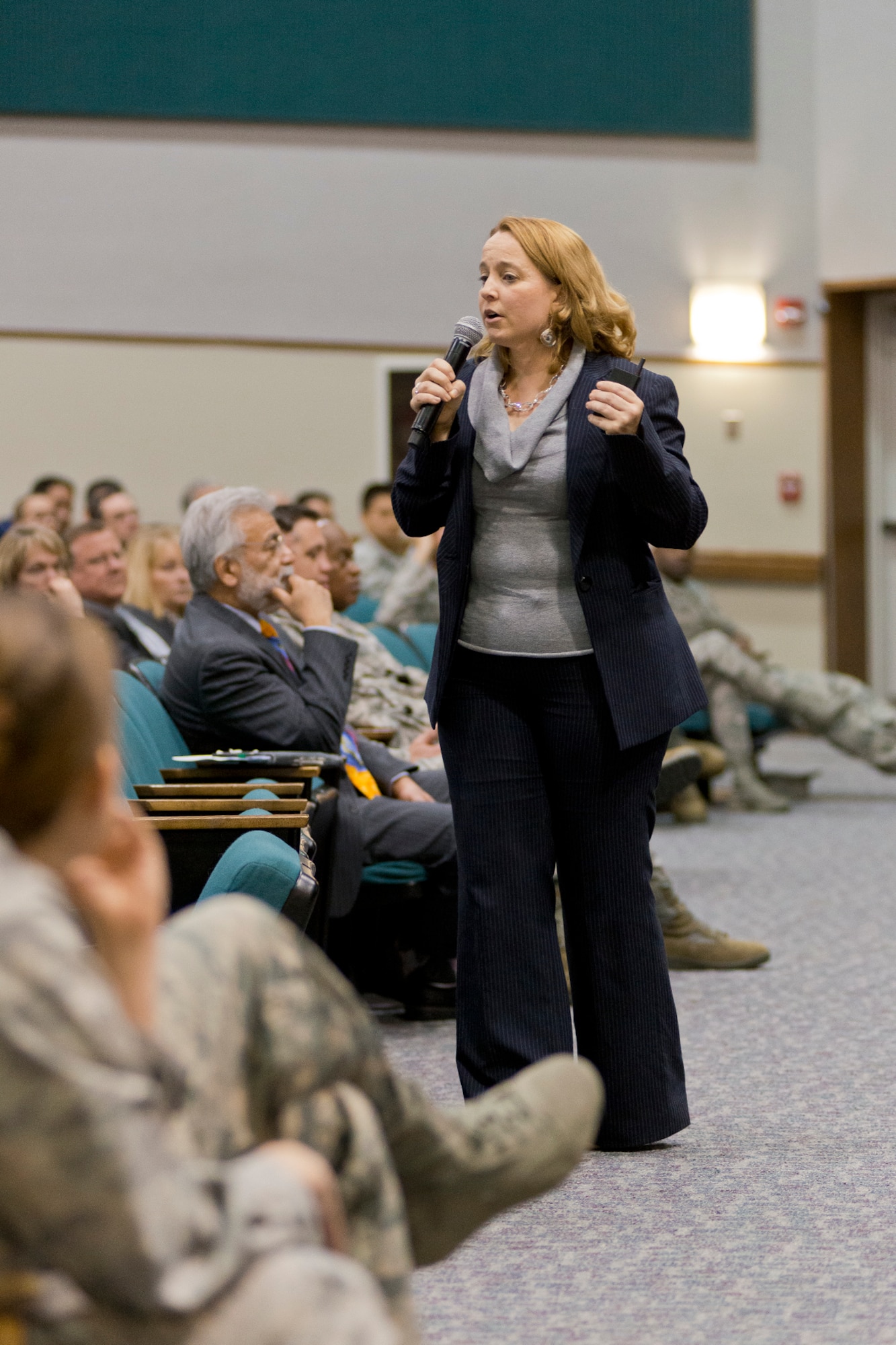 Andrea Verdino, Joint Base Andrews Sexual Assault Response Coordinator, addresses Airmen at the base theater at Joint Base Andrews, Md., April 9, 2015. The Airmen gathered to kick off the start of Sexual Assault Awareness and Prevention Month. (Air National Guard photo by Master Sgt. Marvin R. Preston/RELEASED)