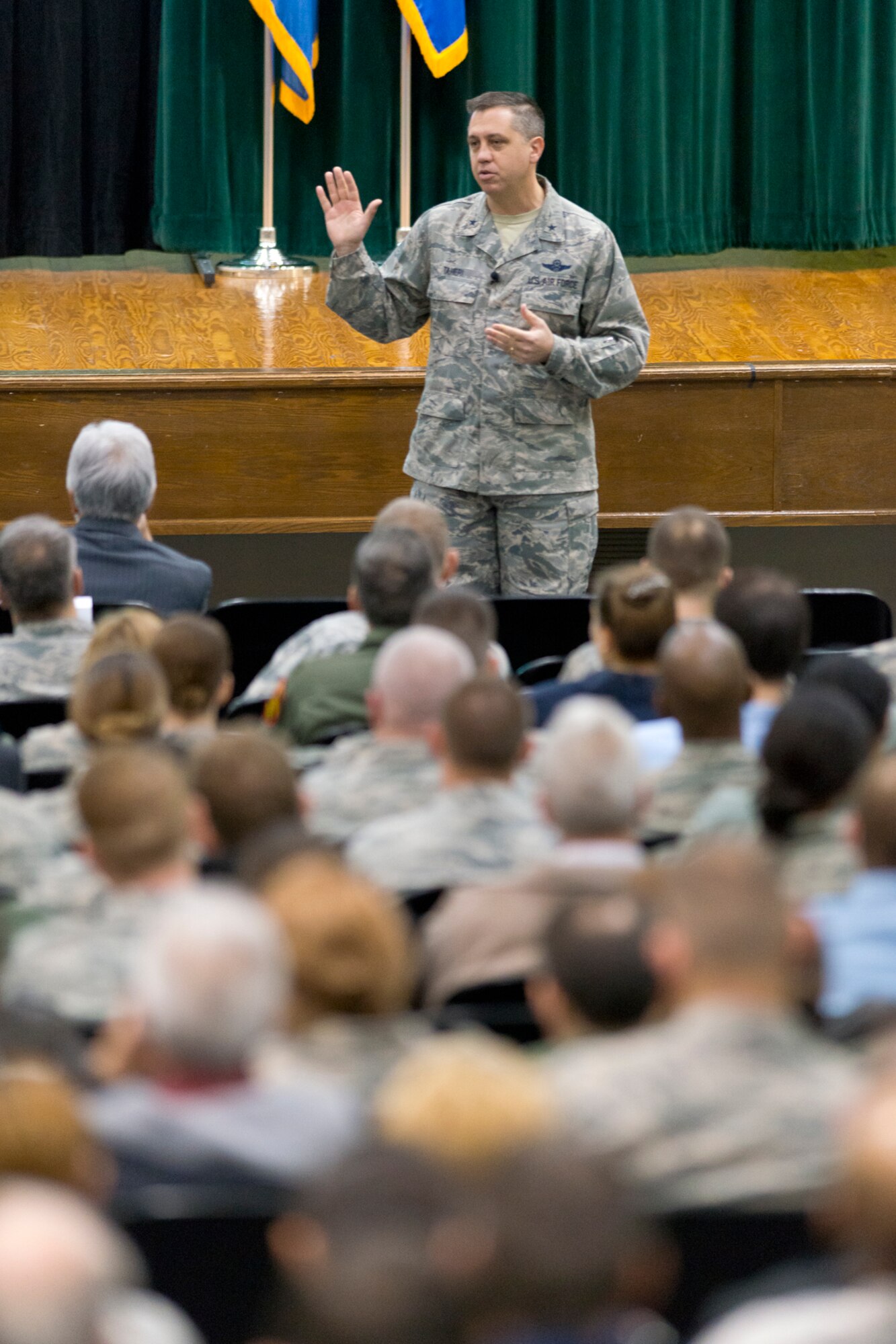Brig. Gen. Michael R. Taheri, commander of the Air National Guard Readiness Center addresses Airmen at the base theater at Joint Base Andrews, Md., April 9, 2015. Airmen gathered to discuss awareness, prevention and ways to care for victims of sexual assault. (Air National Guard photo by Master Sgt. Marvin R. Preston/RELEASED)