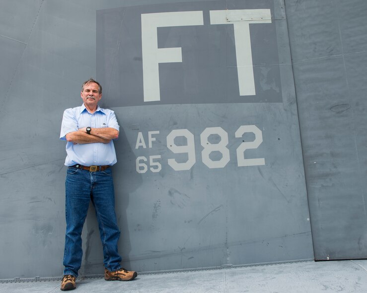 Retired U.S. Air Force Senior Master Sgt. Lawrence Herter, positions himself on the tail of an HC-130P Combat King April 15, 2015, at Moody Air Force Base, Ga. Herter recently retired after serving four years active duty and 32 years reserve. (U.S. Air Force photo by Airman 1st Class Ceaira Tinsley/Released)