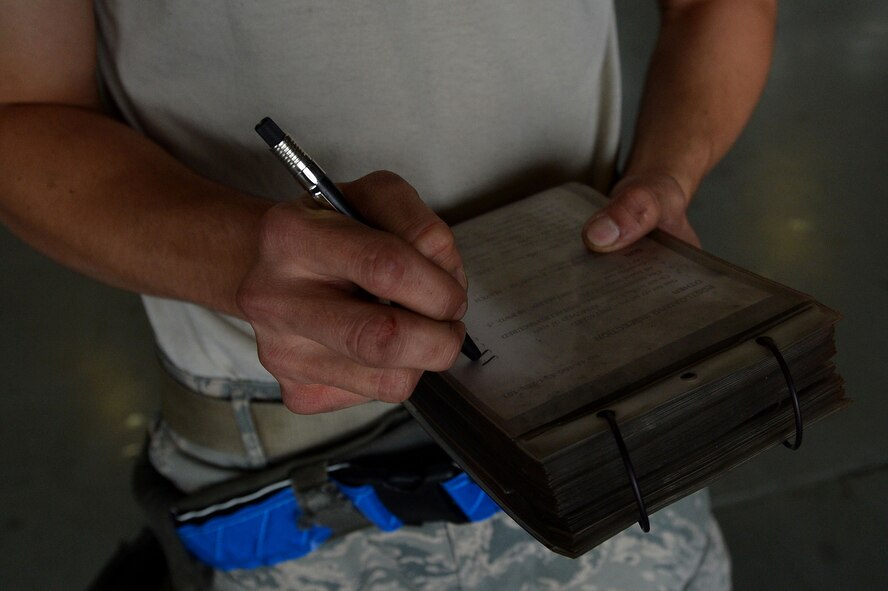 U.S. Air Force Airman 1st Class Omar Hurtado, 20th Aircraft Maintenance Squadron weapons technician, tightens a bolt during a load crew of the year competition at Shaw Air Force Base, S.C., April 17, 2015. Hurtado worked with two other Airmen to load munitions onto an F-16CM Fighting Falcon as quickly as possible in an effort to win the competition. (U.S. Air Force photo by Airman 1st Class Michael Cossaboom/Released)