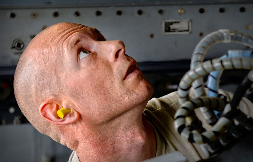 U.S. Air Force Tech. Sgt. Gregory Nunley, 20th Equipment Maintenance Squadron load crew lead, helps load an AIM-9X missile on an F-16CM Fighting Falcon during a load crew of the year competition at Shaw Air force Base, S.C., April 17, 2015. Nunley loaded and inspected each of the munitions with the help of his team to test their loading capabilities. (U.S. Air Force photo by Senior Airman Jensen Stidham/Released)