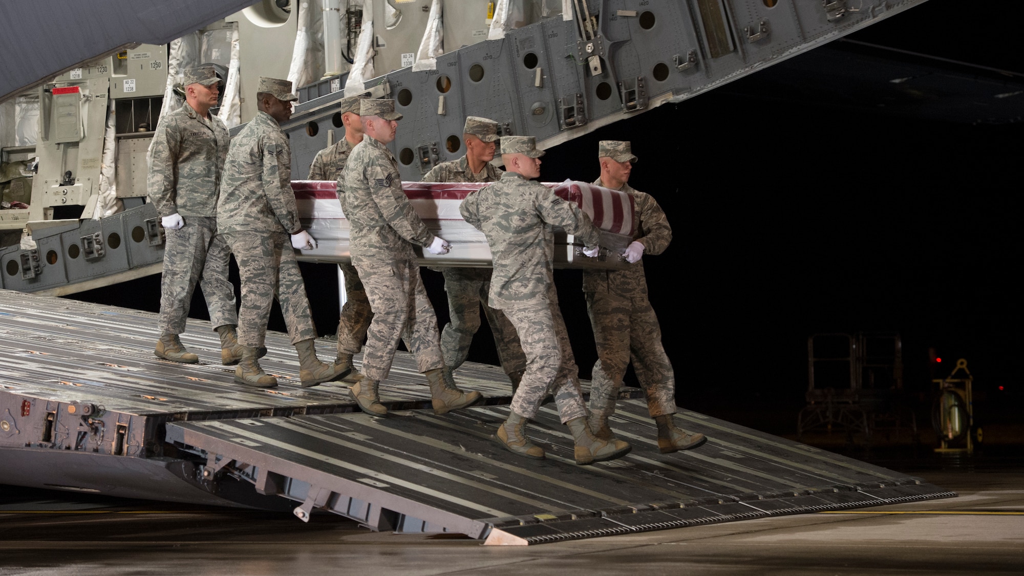 A U.S. Air Force carry team transfers the remains of Tech. Sgt. Anthony E. Salazar of Hermosa Beach, Calif., during a dignified transfer Apr. 17, 2015, at Dover Air Force Base, Del. Salazar was assigned to the 577th Expeditionary Prime Base Engineer Emergency Force Squadron, 1st Expeditionary Civil Engineer Group, U.S. Air Forces Central Command. (U.S. Air Force photo by Airman 1st Class Zachary Cacicia)