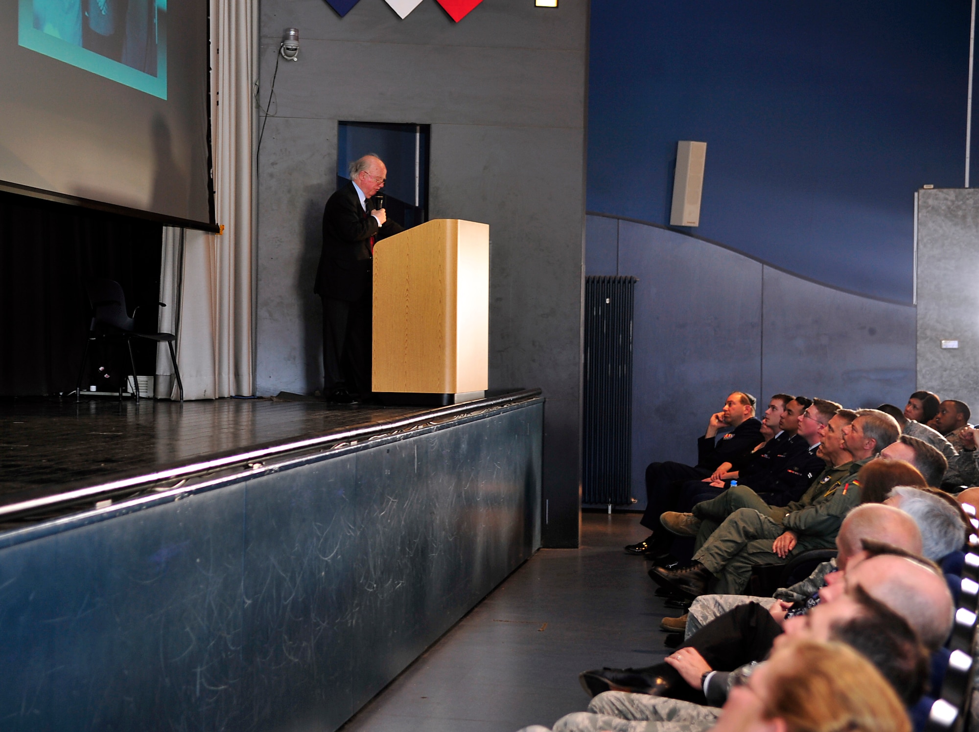 Friedrich Wilhelm von Hase, son of German army Lt. Gen. Paul von Hase, speaks to members of the Kaiserslautern Military Community during a Holocaust Remembrance Day ceremony April 15, 2015, at Ramstein Air Base, Germany. Von Hase spoke about the importance of keeping memories and history alive, good or bad. (U.S. Air Force photo/Airman 1st Class Larissa Greatwood)