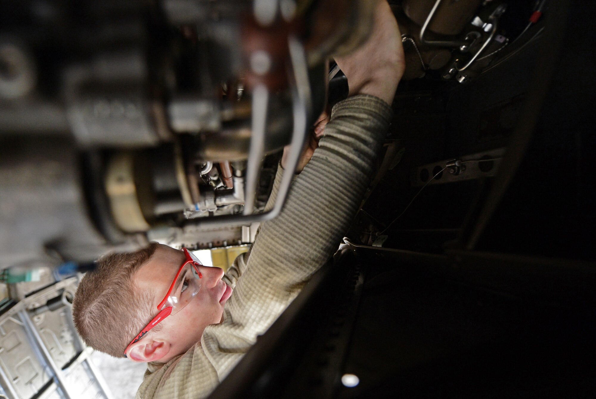 Senior Airman Michael Albers, 48th Aircraft Maintenance Squadron aerospace propulsion journeyman, completes an engine installation on an F-15E Strike Eagle at Royal Air Force Lakenheath, England, April 16, 2015. Albers was nominated for a Liberty Spotlight because he embodies the core value of Service Before Self. (U.S. Air Force photo by Airman 1st Class Erin R. Babis/Released)