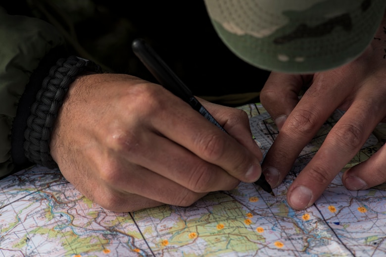 A Czech Republic air force joint terminal attack controller marks the location of training during a theater security package deployment at Namest Air Base, Czech Republic, April 14, 2015. The 354th Expeditionary Fighter Squadron is training with the Czech Republic air force in an effort to increase interoperability and readiness in order to fulfill European security obligations. (U.S. Air Force photo by Staff Sgt. Christopher Ruano/Released)