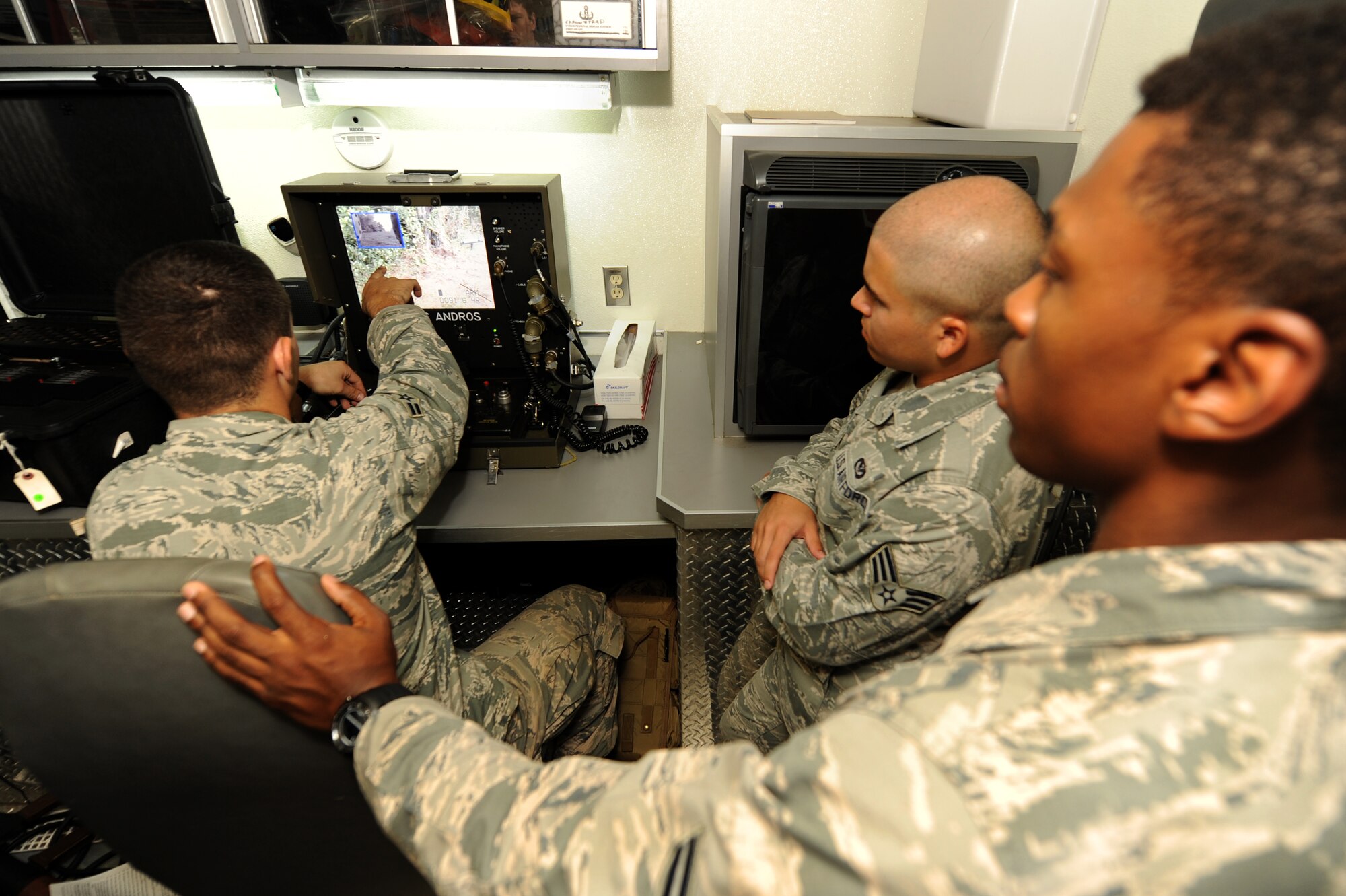 U.S. Air Force Airmen from the 18th Civil Engineer Group work as a team to determine the best course of action for handling simulated unexploded ordnance during an explosive ordnance disposal exercise on Kadena Air Base, Japan, April 20, 2015. The EOD exercise was held in support of April’s mission-focused exercise, which tests the ability of Airmen around the base to perform their primary duties in a simulated wartime environment while simultaneously testing their knowledge of emergency procedures such as self-aid buddy care and EOD identification. (U.S. Air Force photo by Airman 1st Class Zade C. Vadnais)