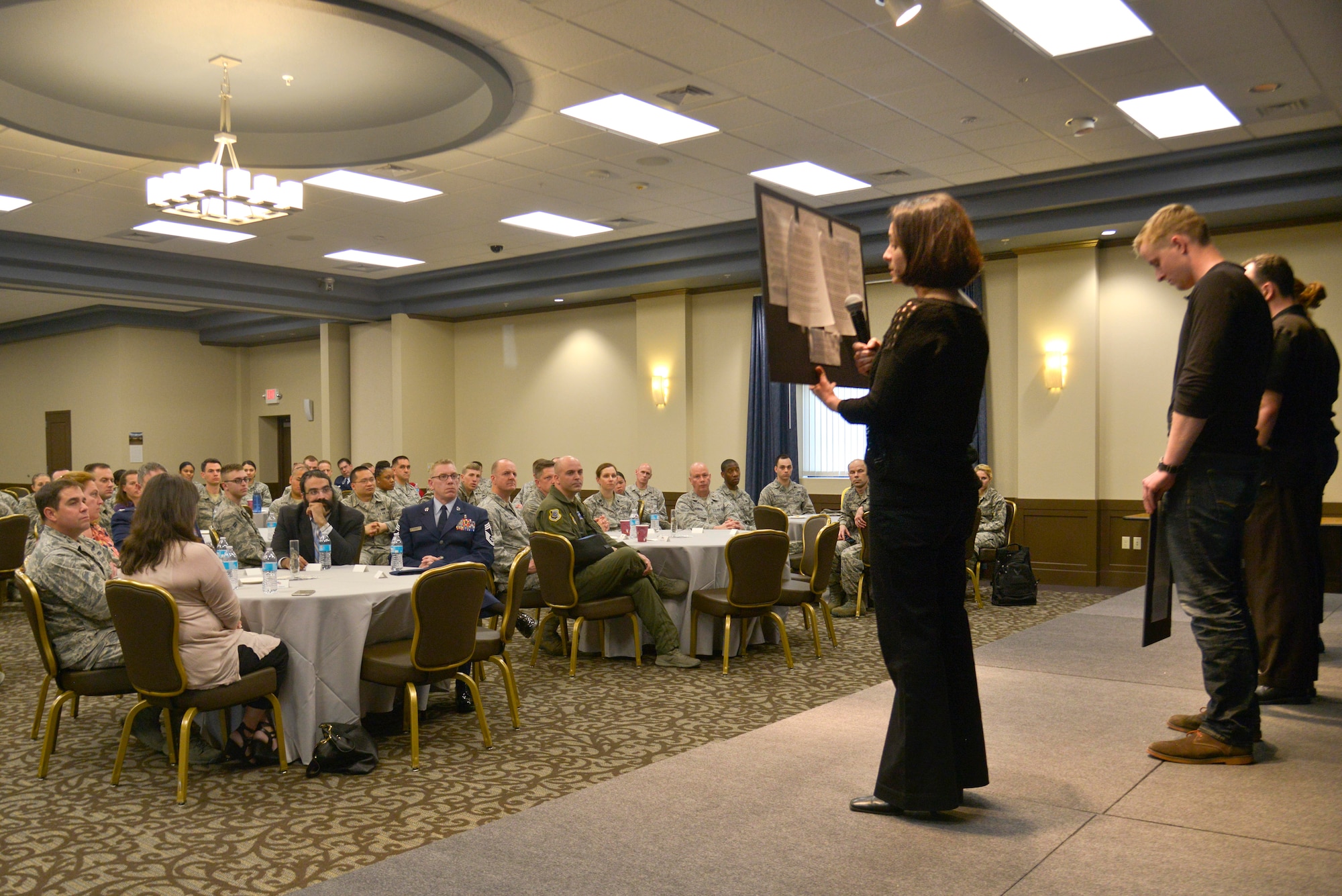 Fairchild Airmen listen while members of the Toastmasters Club share the first person experiences of several Holocaust survivors during the Holocaust Remembrance Day Event April 16, 2015, at Fairchild Air Force Base, Wash. During the Holocaust, the Nazi regime and its collaborators persecuted and murdered six million Jews. Fairchild Airmen took the time to remember and honor not just the survivors, but also those who were killed during the tragic event. (U.S. Air Force photo/Senior Airman Janelle Patiño)