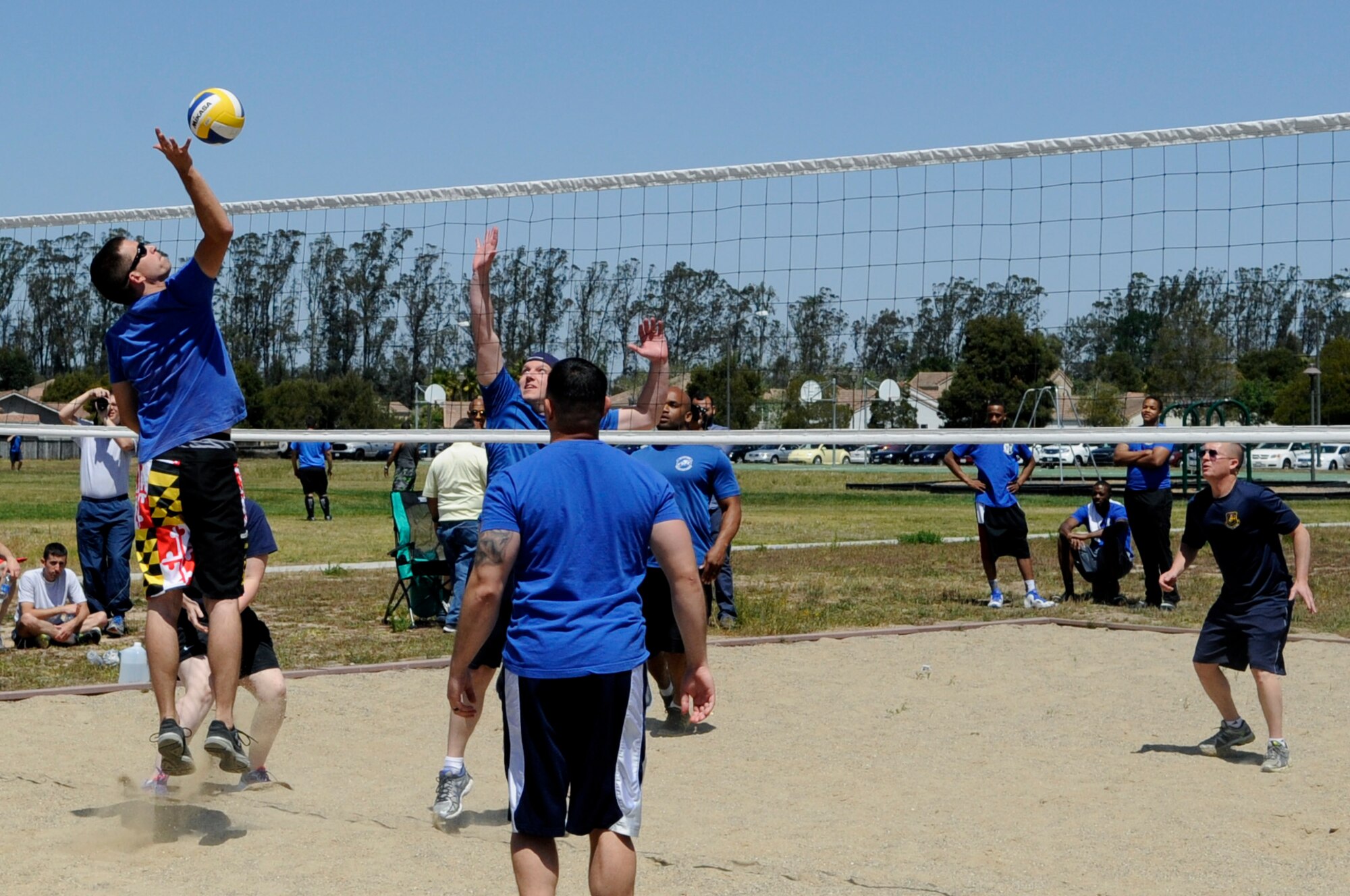 Members of the 30th Space Communications Squadron play volleyball with members of the 614th Air and Space Communications Squadron during a cyber sports challenge, April 17, 2015, Vandenberg Air Force Base, Calif. The event aimed to build camaraderie while pitting the base’s two communications squadrons, the 614th Air and Space Communications Squadron and the 30th Space Communications Squadron, against each other in a series of friendly, yet competitive, physical competitions. (U.S. Air Force photo by Senior Airman Shane Phipps/Released)