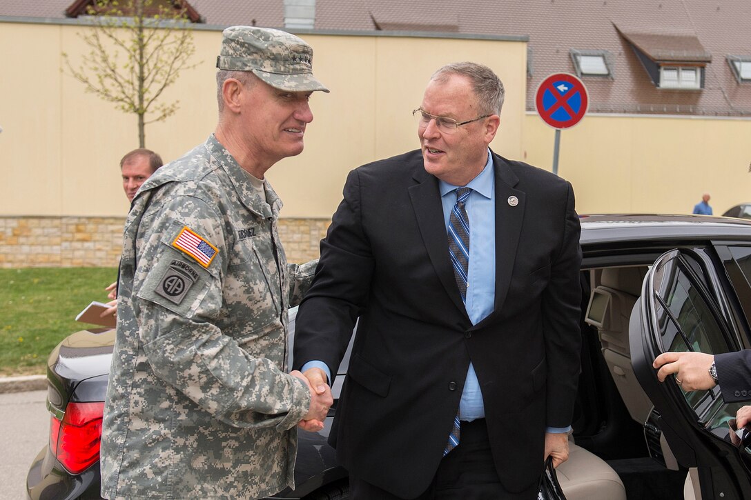 U.S. Army Gen. David Rodriguez, commander of U.S. Africa Command, greets U.S. Deputy Defense Secretary Bob Work, right, as he arrives at Kelley Barracks, Germany, April 17, 2015, to meet with service members assigned to the command and discuss matters of importance to the command.