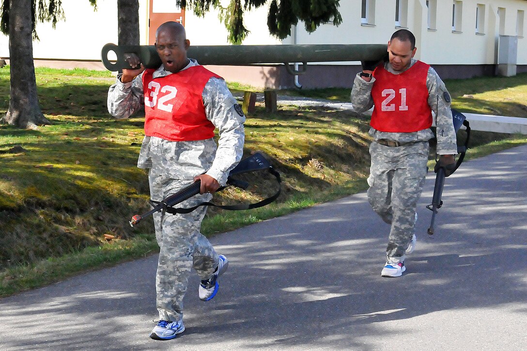 U.S. Army Staff Sgt. Andre Daniel, left, and U.S. Army Sgt. 1st Class Raluchi Ikegwuonu participate in physical fitness assessment during the Best Medic Competition on Grafenwoehr Training Area, Germany, April 14, 2015. Daniel and Ikegwuonu are assigned to Headquarters Detachment, Europe Regional Medical Command.