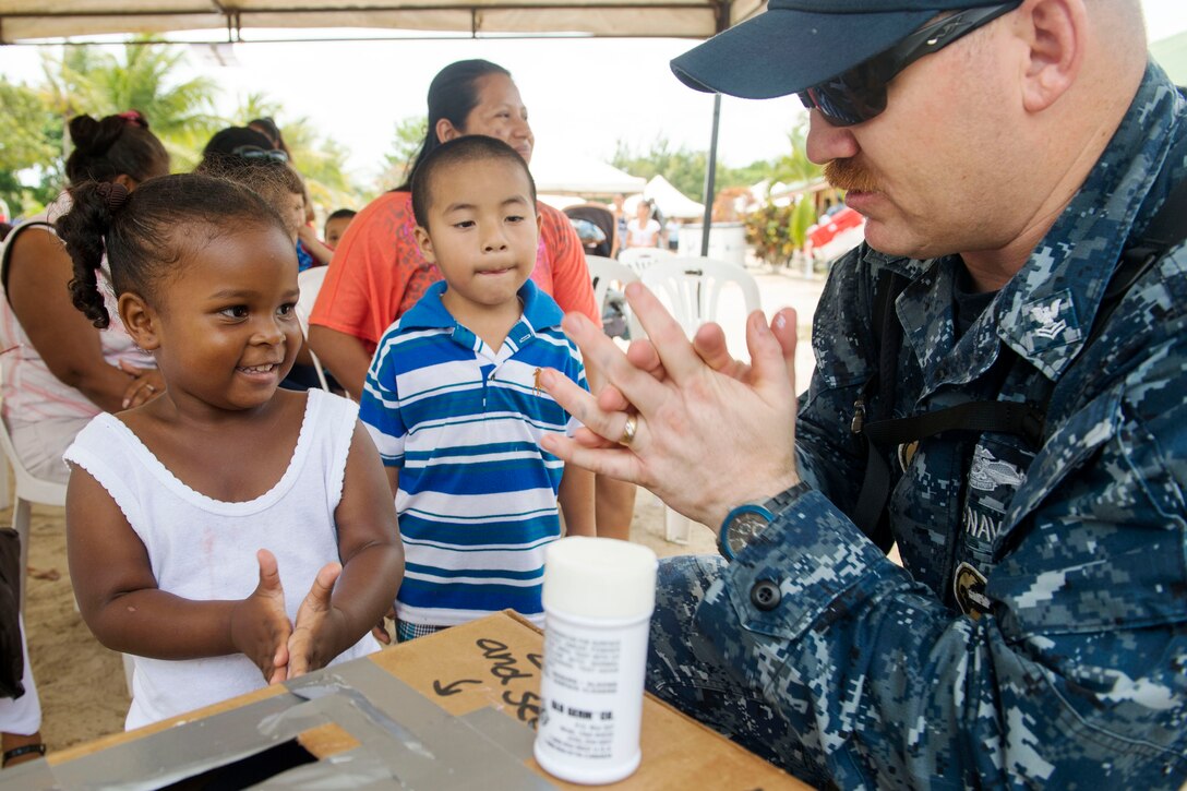 U.S. Navy Petty Officer 2nd Class Luke Peet teaches Belizean children how to wash their hands at the Independence Polyclinic during Continuing Promise 2015 in Independence, Belize, April 14, 2015.