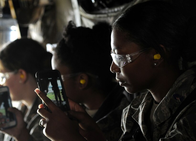 An Air Force ROTC cadet takes a video with her phone during a CV-22 Osprey orientation flight with members of the 58th Special Operations Wing, Kirtland Air Force Base, N.M. during the “Pathways to Blue” diversity outreach event April 18, 2015, Keesler Air Force Base, Miss. Hosted by 2nd Air Force, the event provides a way to demonstrate Keesler’s and Air Education and Training Command’s technical and flight training capabilities while informing cadets about career choices available in the Air Force when deciding what path to take after college. (U.S. Air Force photo by Airman 1st Class Duncan McElroy)