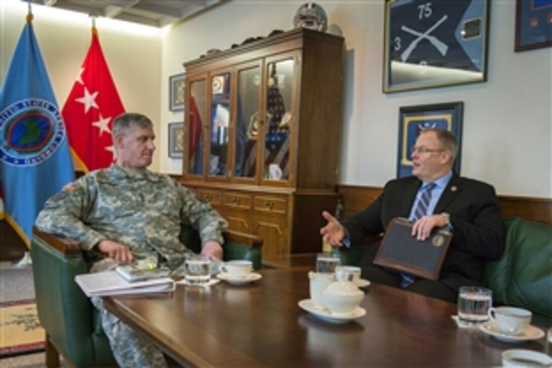 U.S. Deputy Defense Secretary Bob Work, right, meets with U.S. Army Gen. David Rodriguez, commander of U.S. Africa Command, during a visit to Kelley Barracks, Germany, April 17, 2015.
